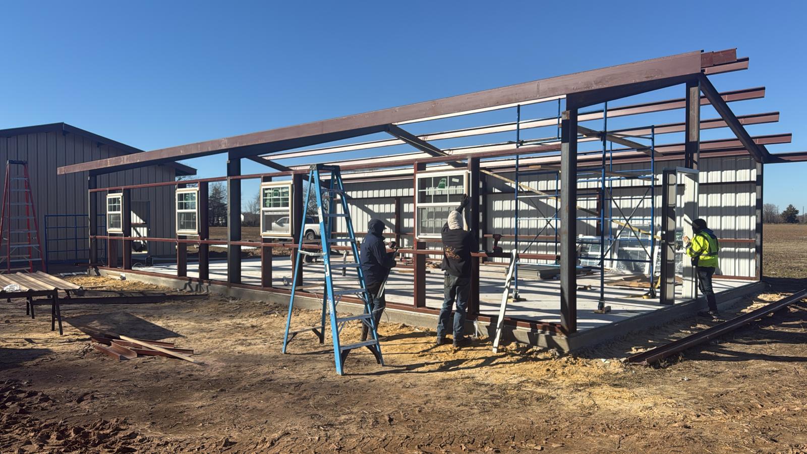 BuiltecUSA team working on a steel structure